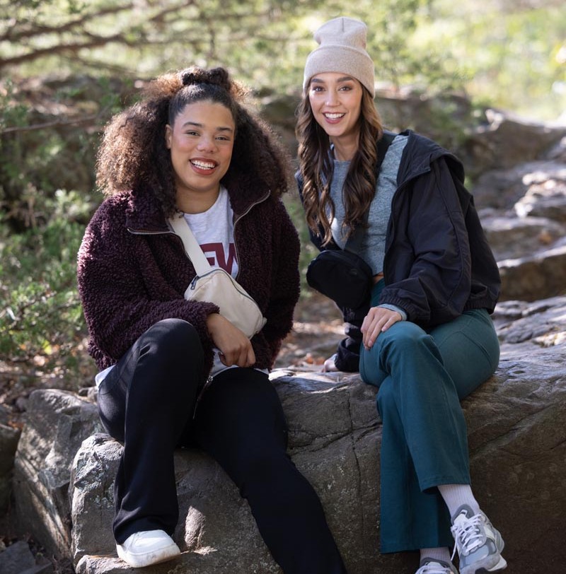 2 girls posing infront of mountain background